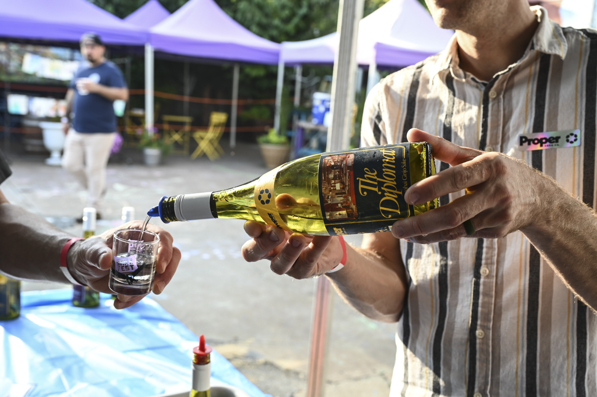 Man pouring sake into a glass.